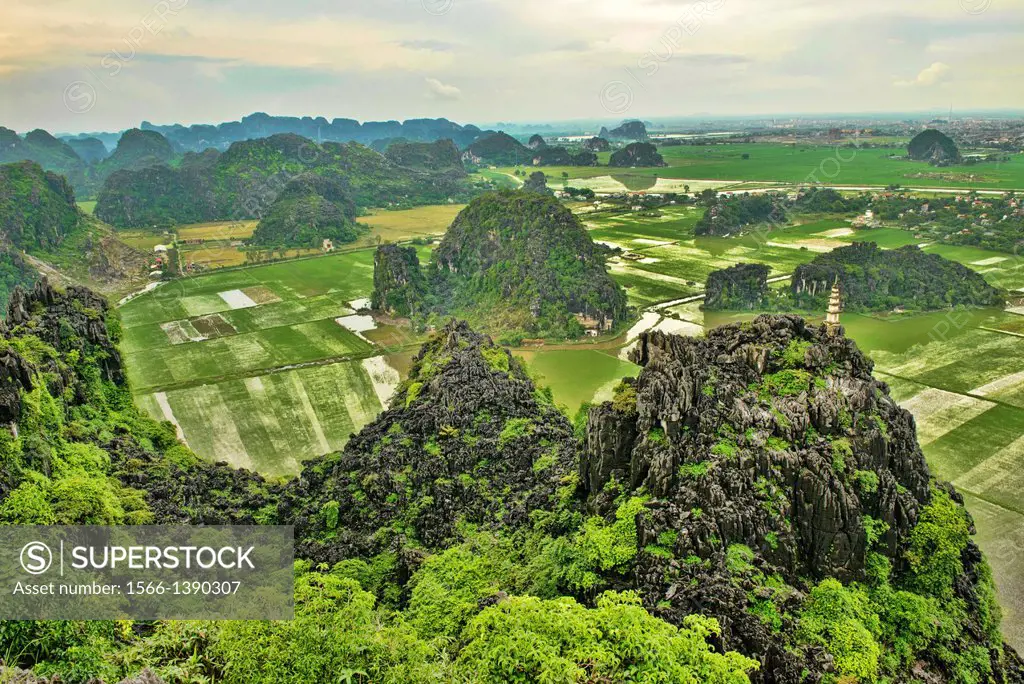 Vietnam. Beautiful limestone karst mountains in Ninh Binh. Image taken from the top of Hang Mua Temple which overlooks the Tam Coc river area as well ...