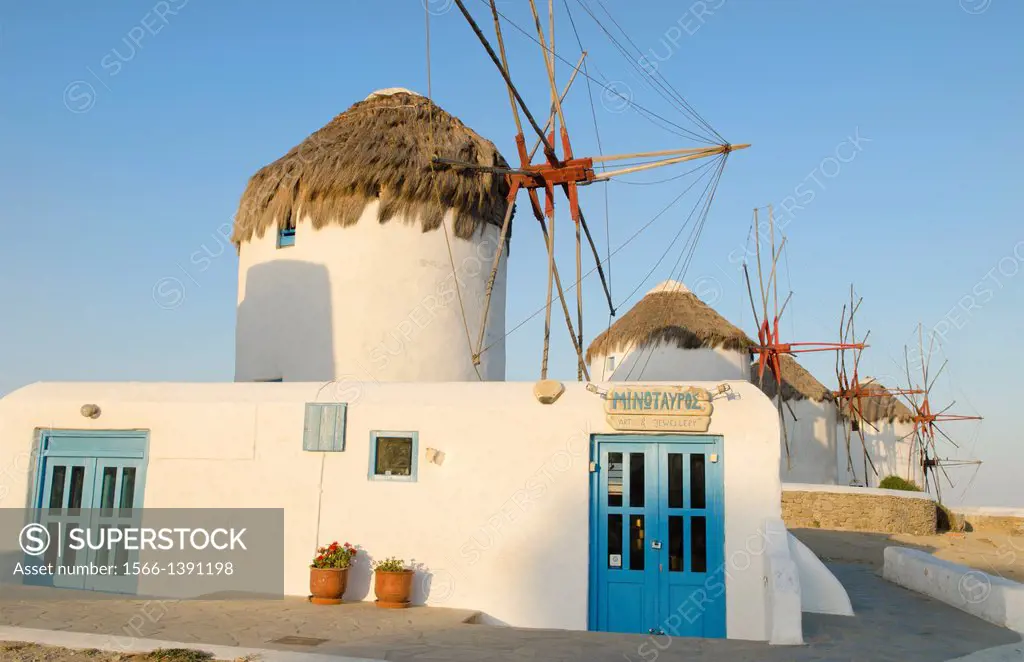 Mikonos Greece famous five old 14th Century Windmills of white at sunrise.