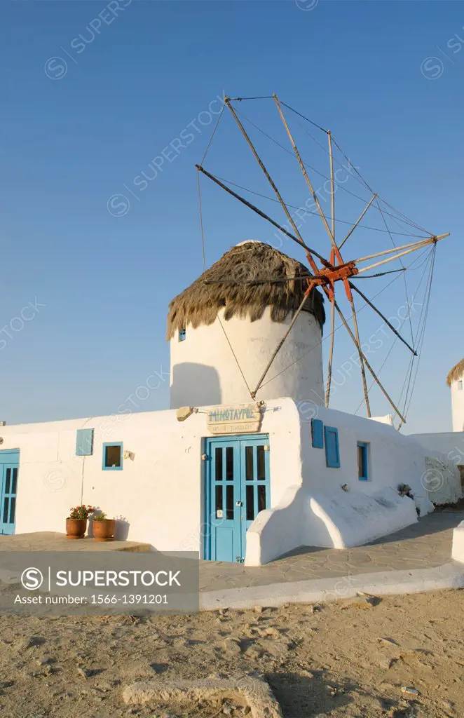 Mikonos Greece famous five old 14th Century Windmills of white at sunrise closeup of one windmill.
