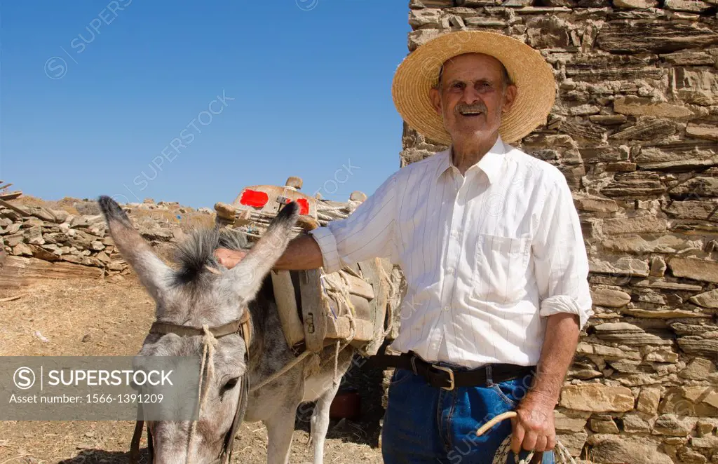Greece Paros Cyclades old local man with donkey near Lefkes in mountains at his farm home 8.