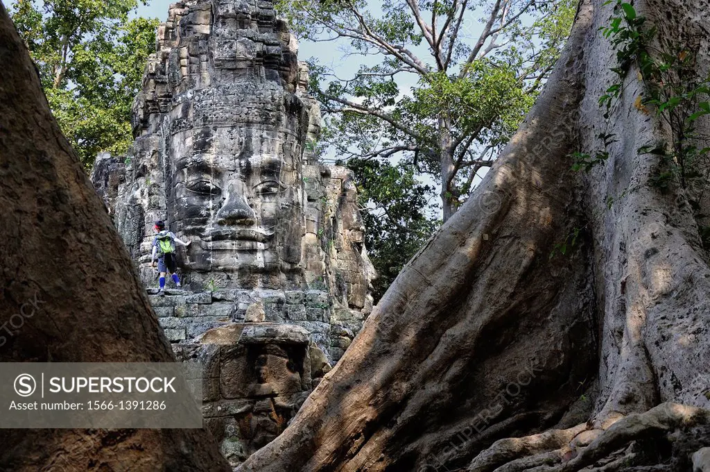 Enigmatic Lokesvara stone faces on the east gate of Angkor Thom. Cambodia, Siem Reap, Angkor.