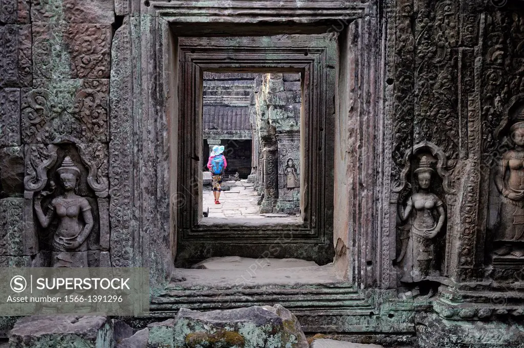 Woman visting Preah Khan temple. Cambodia, Siem Reap, Angkor.