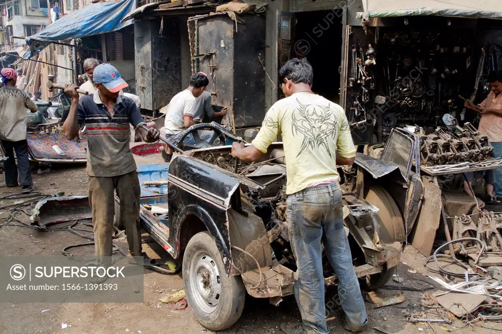 Dismantling of an old Taxi in Chor Bazaar in Mumbai, India.