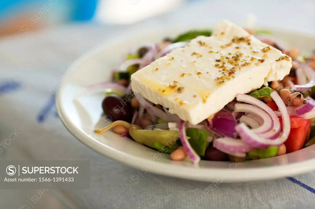 Greek Salad wiating to consume on the table, Koufonissi, Cyclades Islands, Greek Islands, Greece, Europe.