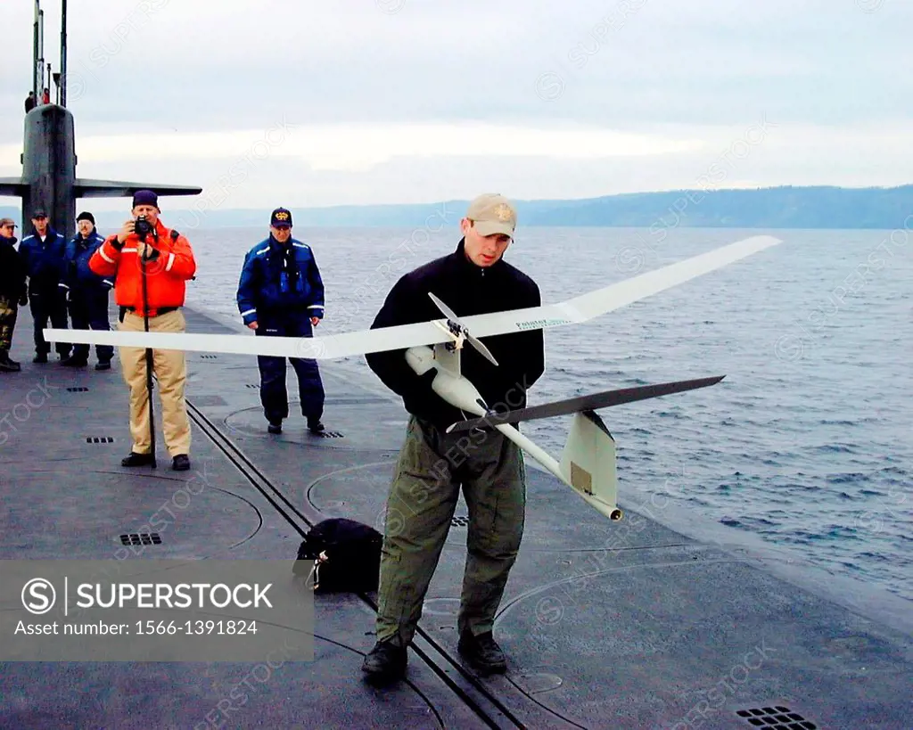 Air Force special operations forces from the 22nd and 23rd Special Tactics Squadrons prepare to launch a Pointer UAV from the deck of USS Alabama (SSB...