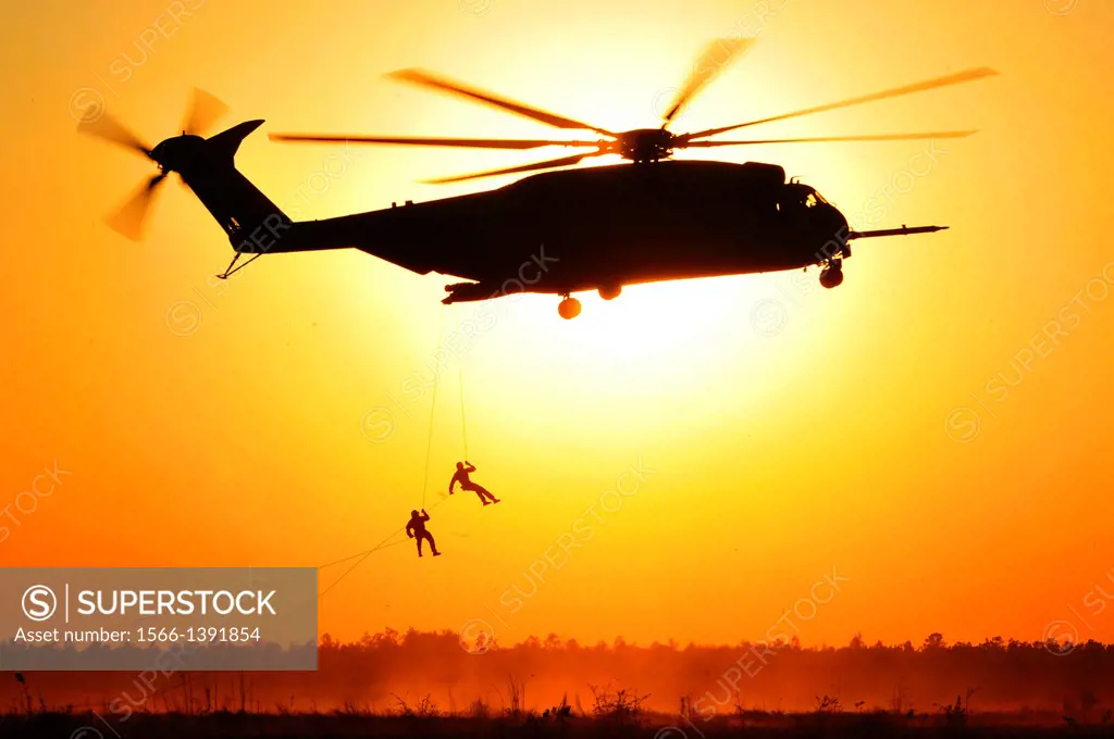 U.S. Army special operators repels out of a U.S. Marine Corps CH-53E Super Stallion helicopter during Emerald Warrior 2013 at Hurlburt Field, Fla., Ap...