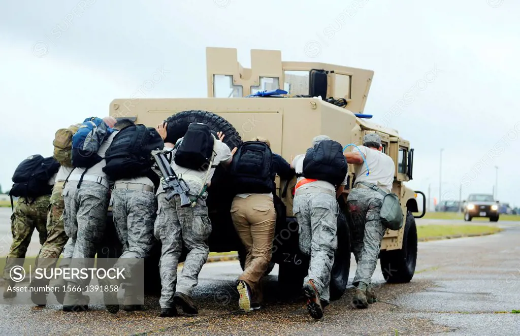 A Monster Mash team pushes a Humvee July 3, 2013, during the 352nd Special Operations Group Olympics at RAF Mildenhall, England. The Monster Mash cons...