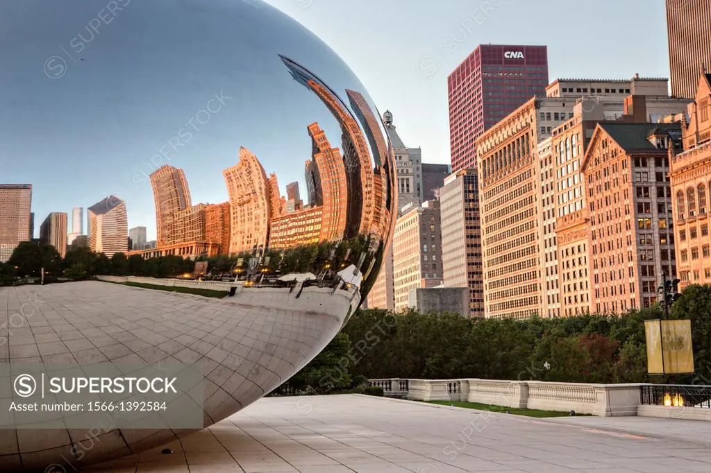 Cloud Gate Sculpture or The Bean with downtown skyline reflected in polished surface Millennium Park in Chicago USA.