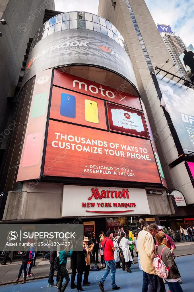 Advertising in Times Square in New York for the Moto X, the first smartphone Motorola since it was acquired by Google. The billboard on the Marriott M...