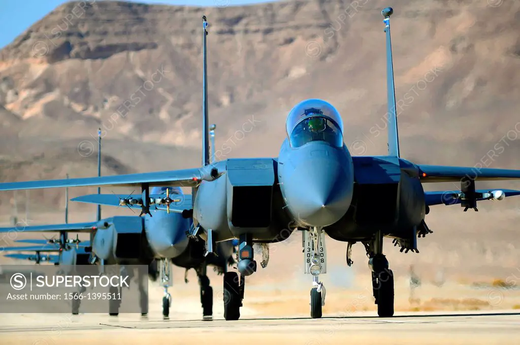A group of F-15E Strike Eagles taxi following a combat mission during Blue Flag exercise Nov. 26, 2013, on Uvda Air Force Base, Israel. Aircraft from ...