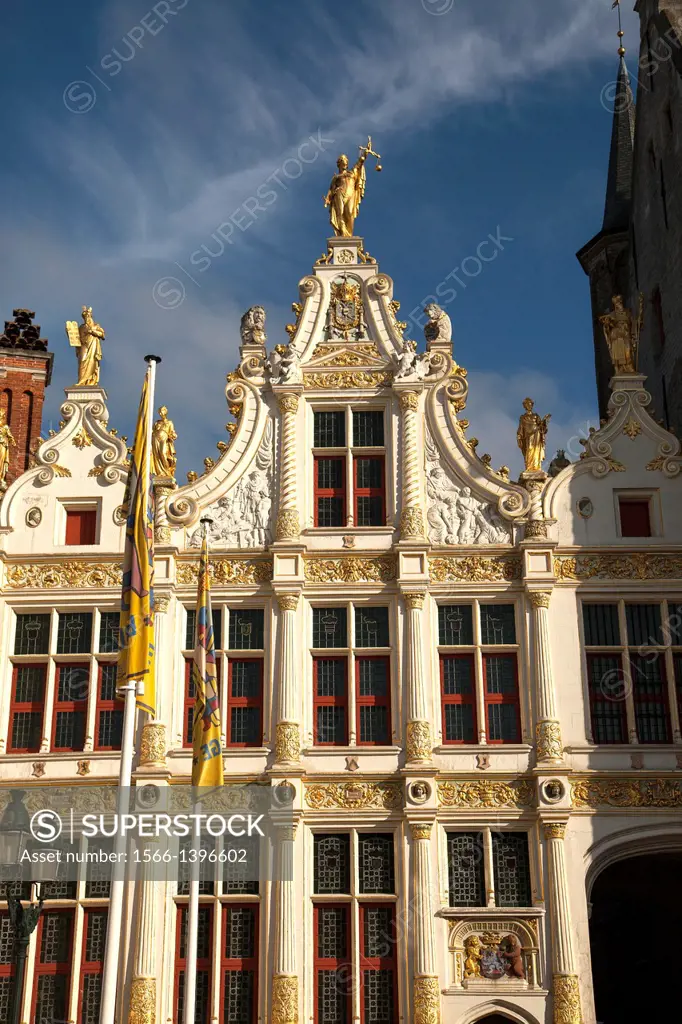 Justitia on the Chancellory decorated with gold in the historic center of Bruges, Belgium.