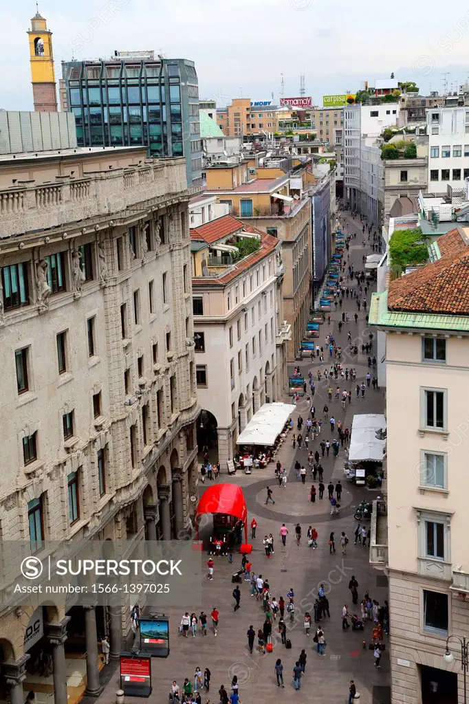 Pedestrians walking along Corso Vittorio Emanuele II in Milan Italy.