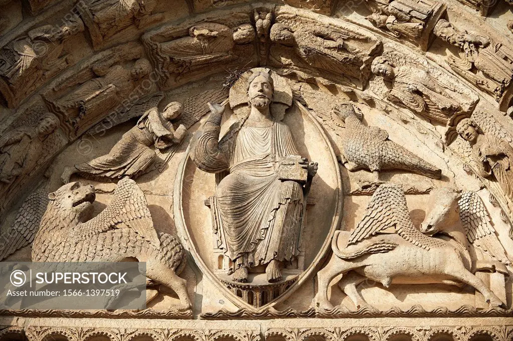 West Facade, Central Portal Tympanum - General View c. 1145. Cathedral of Chartres, France . The tympanum shows gothic sculptures of Jesus Christ in M...