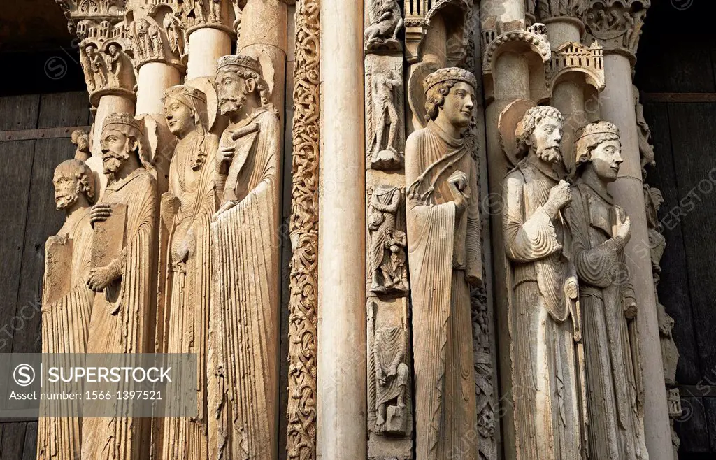 West Facade, Central Portal - Right Jamb Figures- General View c. 1145. Cathedral of Chartres, France . Gothic statues of figures. The group to the le...