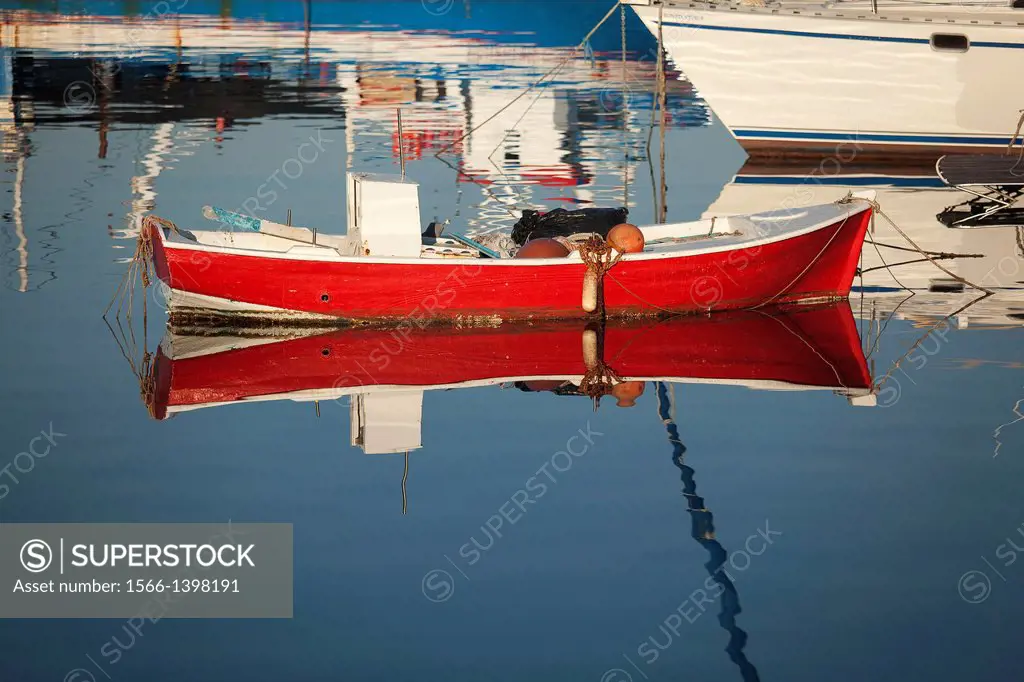 Fishing boats and its reflections inside the harbour, Naxos, Cyclades Islands, Greek Islands, Greece, Europe.