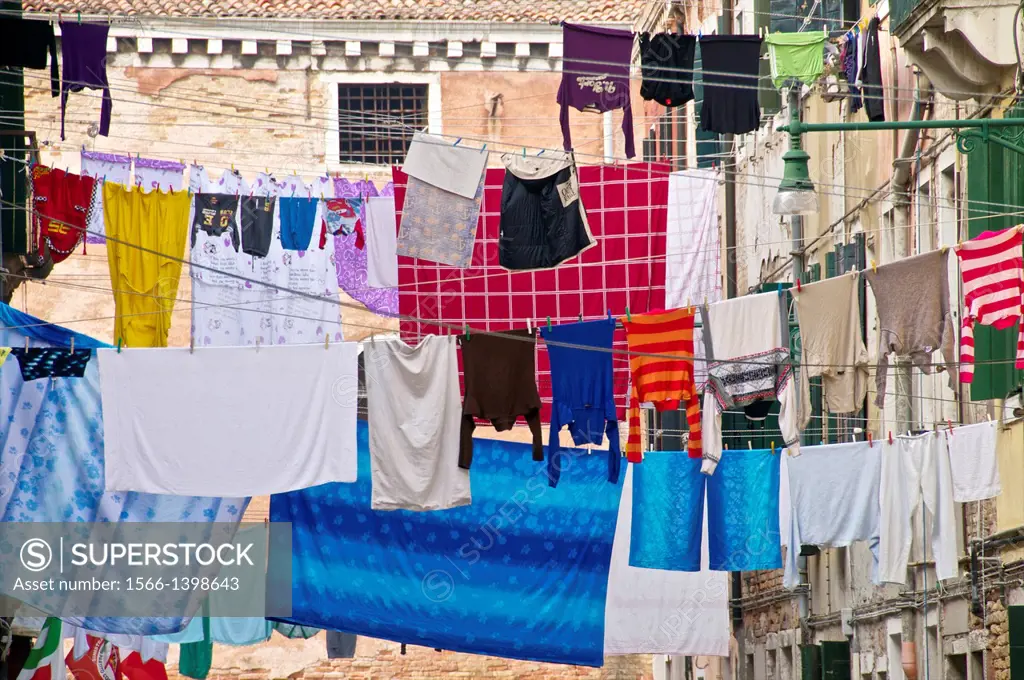 hanging lines of drying washing, across the street, Castello quarter, Venice, Italy.