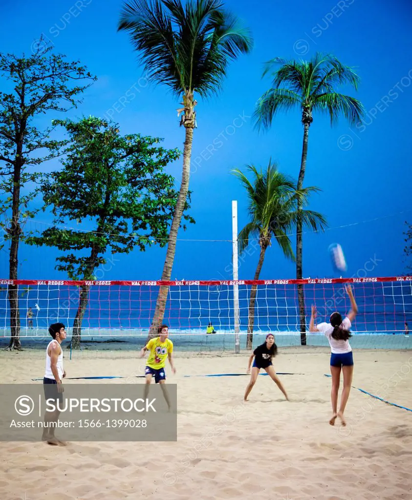People playing volleyball at Praia do Meireles, Fortaleza, Brazil.