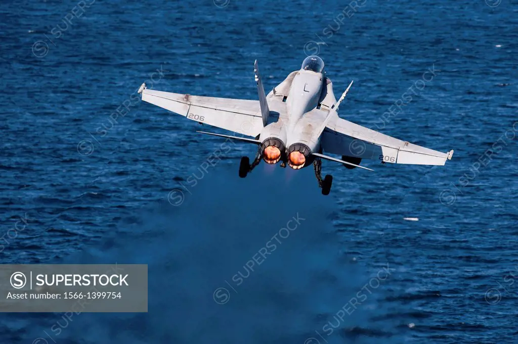 GULF OF OMAN (Nov. 25, 2013) An F/A-18C Hornet assigned to the ´Checkerboards´ of Marine Fighter Attack Squadron 312 launches from the flight deck of ...