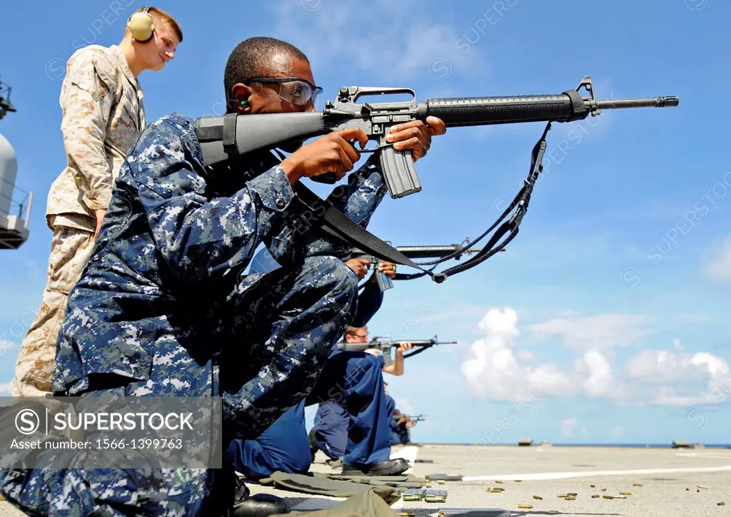 PACIFIC OCEAN (July 23, 2010) Operations Specialist 2nd Class Marcus Broomfield fires an M-16 rifle during a weapons qualification shoot aboard the U....