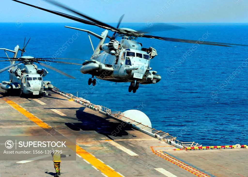 PACIFIC OCEAN (March 29, 2011) A CH-53E Sea Stallion helicopter, assigned to Marine Medium Helicopter Squadron (HMM) 262, takes off from the forward-d...