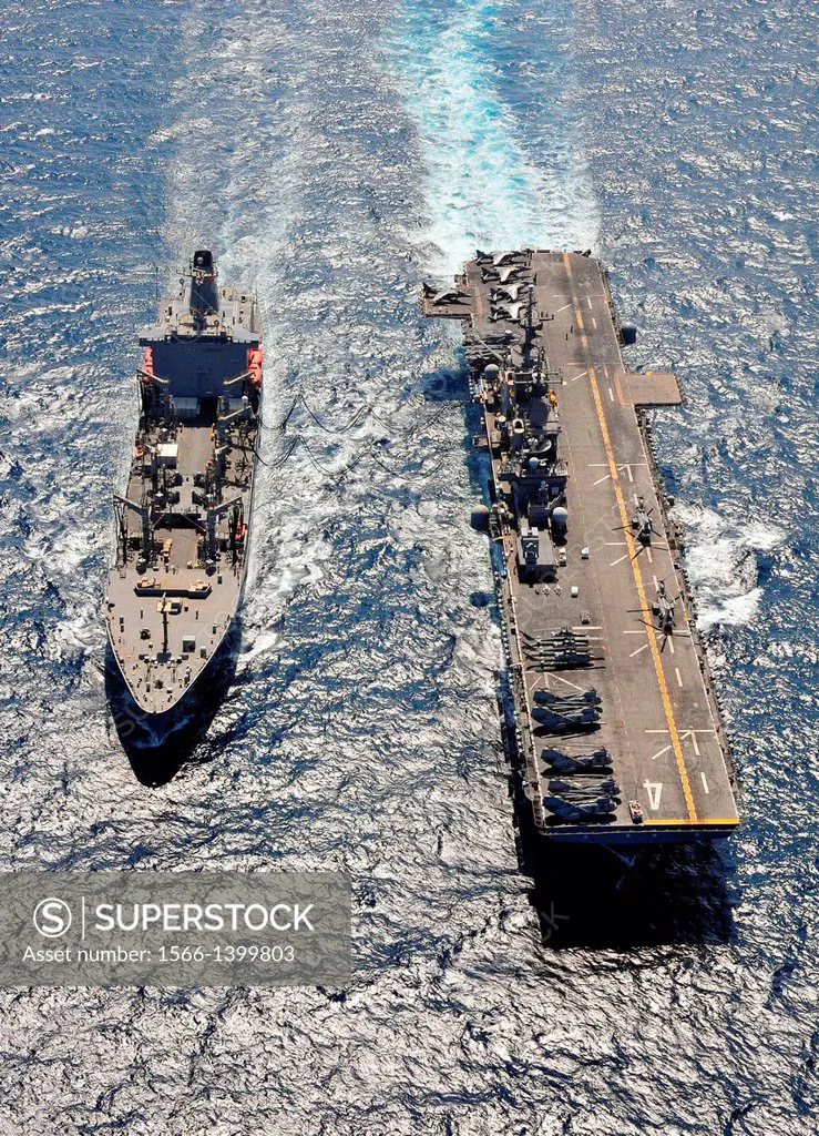 ARABIAN SEA (April 17, 2011) The amphibious assault ship USS Boxer (LHD 4) conducts a replenishment at sea with the Military Sealift Command fleet rep...