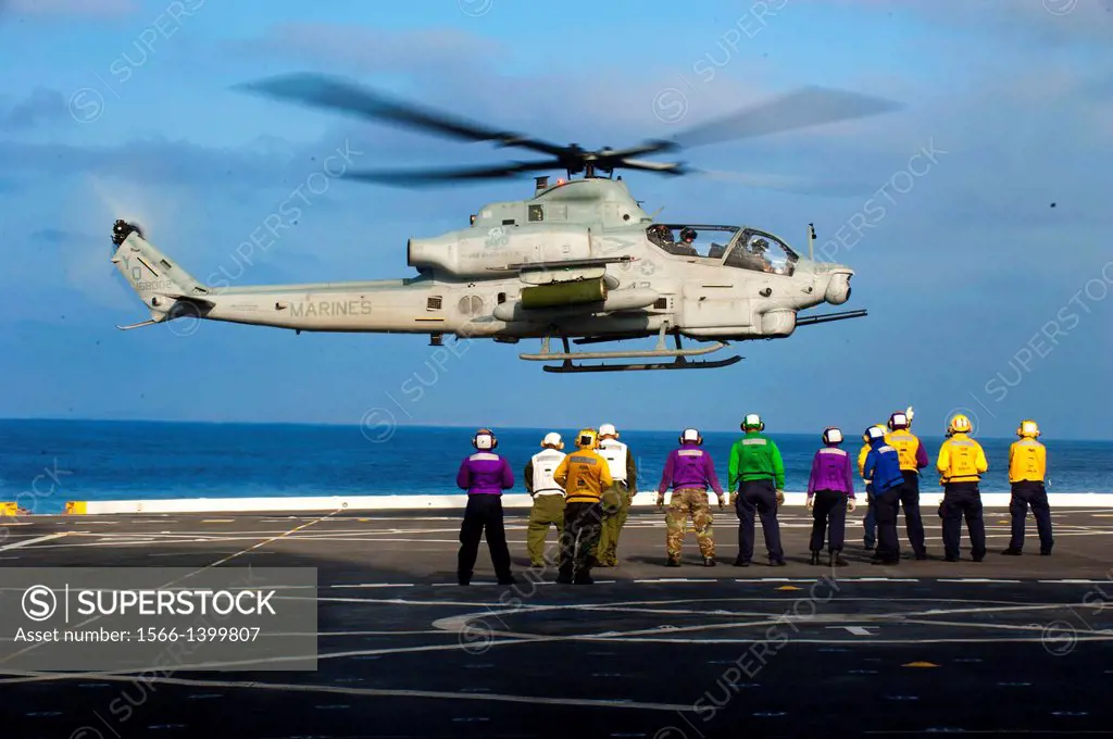 PACIFIC OCEAN (Aug. 12, 2011) Sailors and Marines aboard the San Antonio-class amphibious transport dock ship USS New Orleans (LPD 18) observe a Marin...