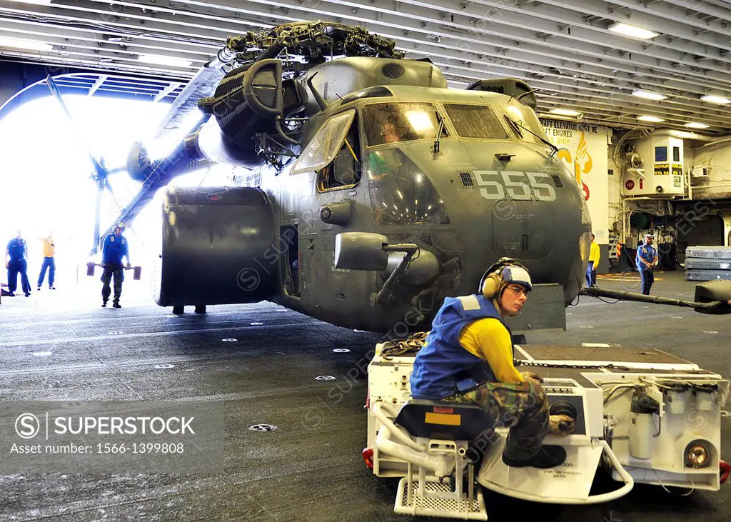 ATLANTIC OCEAN (Aug. 26, 2011) An MH-53E Sea Dragon helicopter assigned to Helicopter Mine Countermeasure Squadron (HM) 14 is moved into the hangar ba...