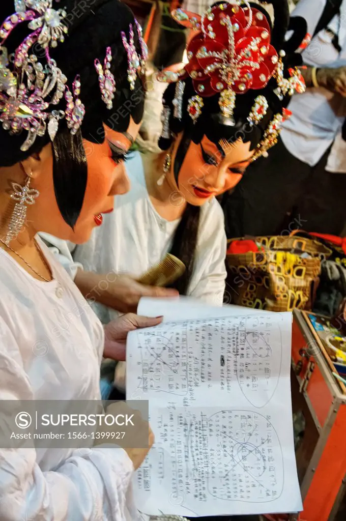 Chinese opera performers prepare for a performance at the Vegetarian Festival in Bangkok, Thailand.