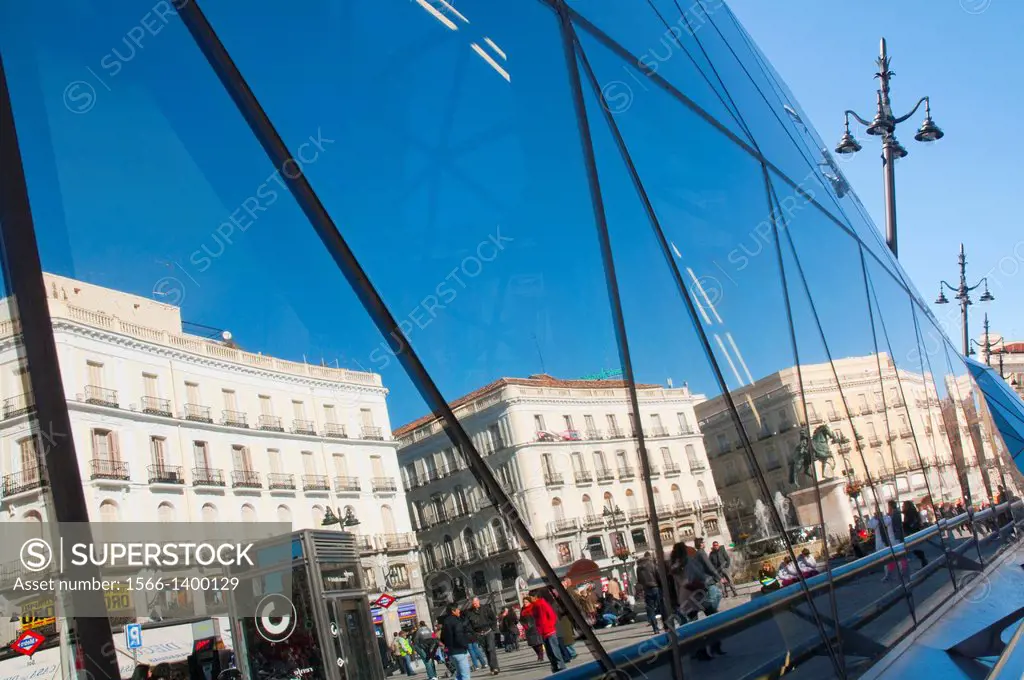Buildings reflected on the glass facade of the new station. Puerta del Sol, Madrid, Spain.