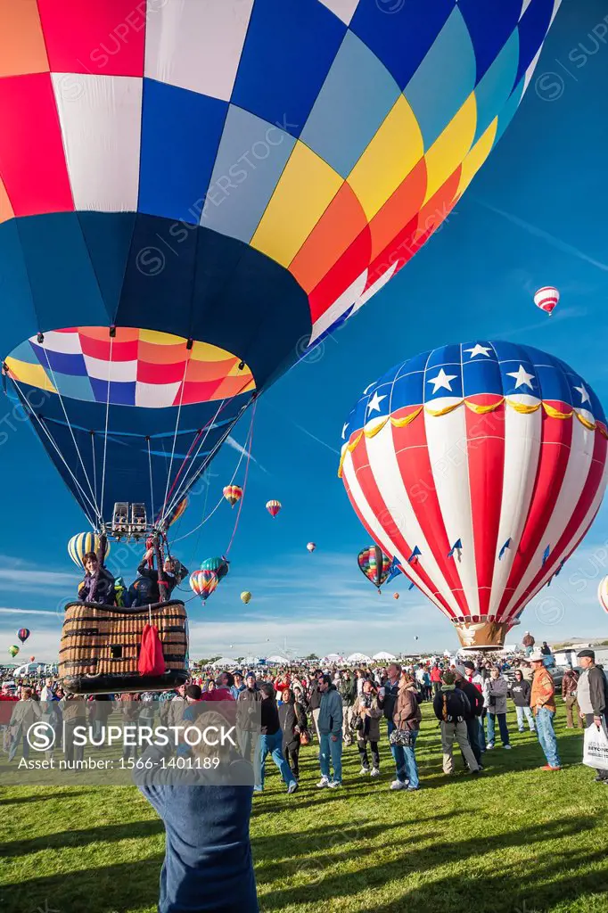 Early morning launch of balloons at the Albuquerque Balloon Festival, New Mexico, USA.