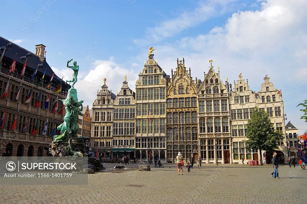 A woman photographs a small child in the center of Antwerp´s historic Grote Markt.