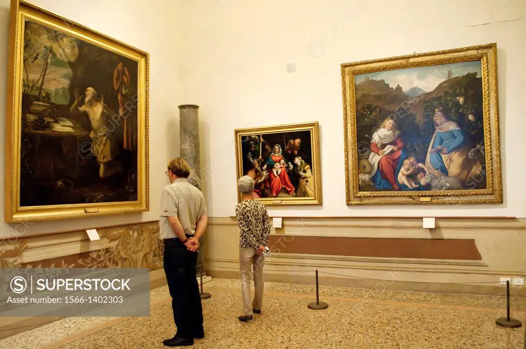 Visitors looking at paintings, Palazzo Barberini, Rome, Italy.