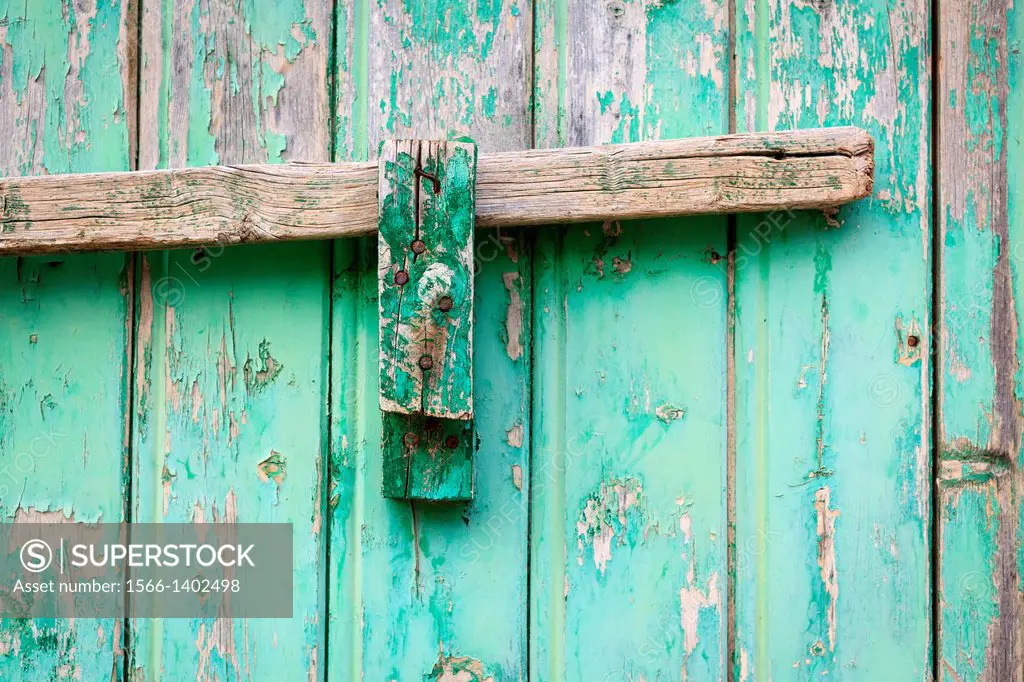 Wood bolt on old wooden door. Azaila. Teruel province. Aragon. Spain.