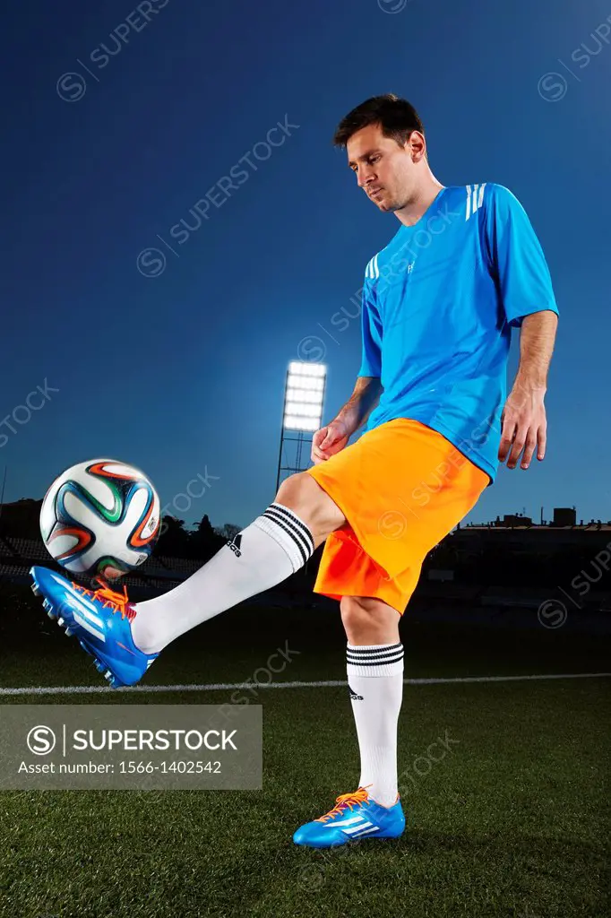 Lionel Messi (Argentina) with Adidas Brazuca, official match ball of the  FIFA World Cup Brasil 2014. - SuperStock