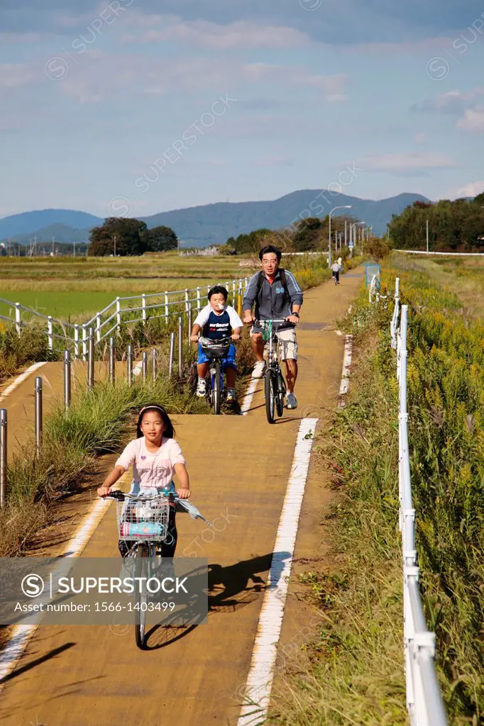 Japanese Cyclist on the Rails for Trails Tsukuba Bike Route.