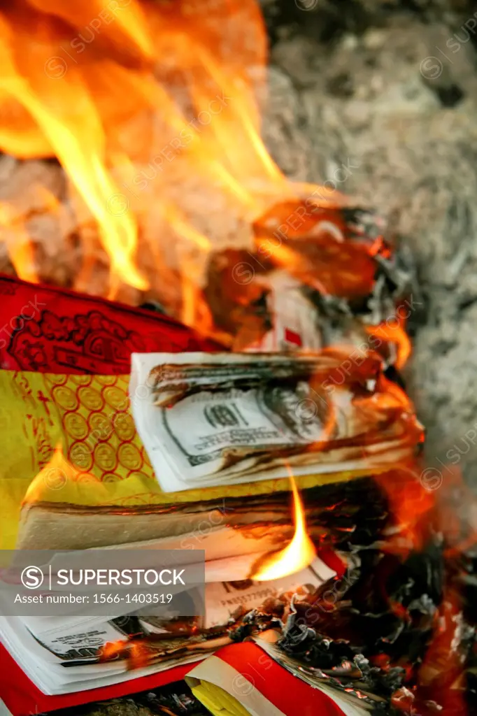 Burning Lucky Money - Joss paper also known as ghost money are sheets of paper that are burned in traditional Chinese deity or ancestor worship ceremo...
