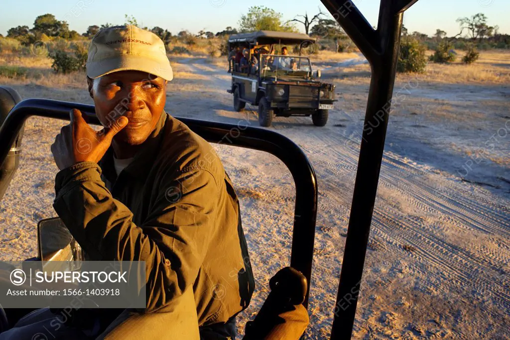 One of the guides Savute Elephant Camp by Orient Express in Botswana in the Chobe National Park . uploaded to one of the 4x4 vehicles at the time of a...
