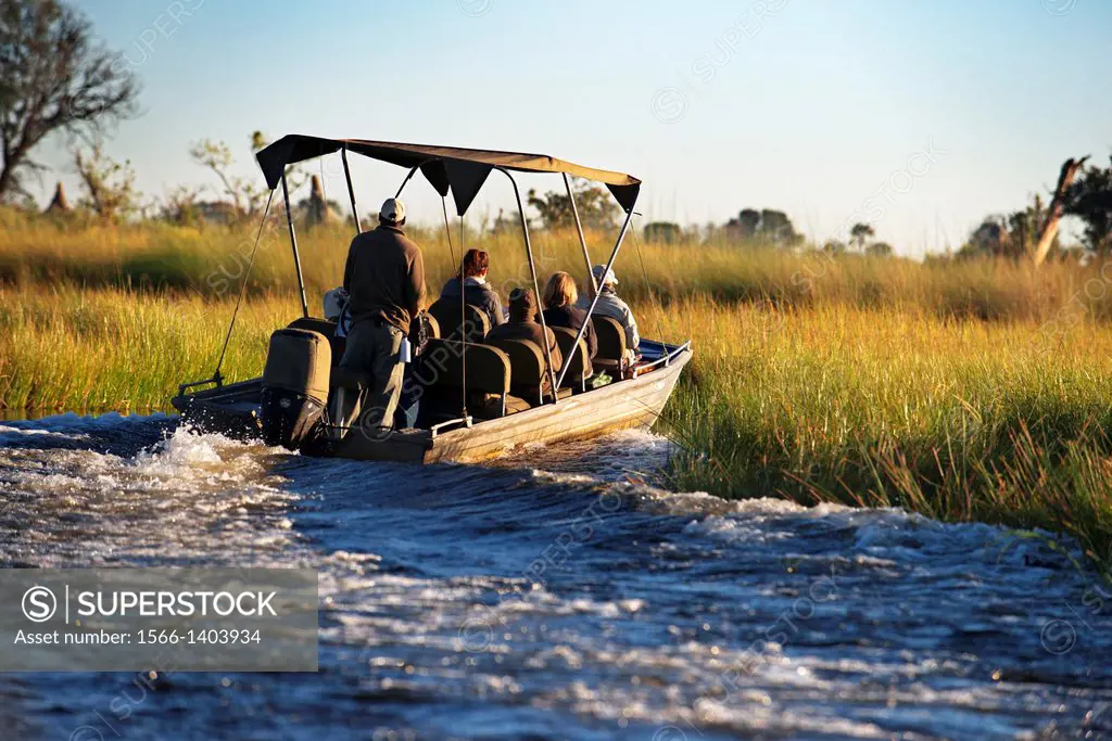 A speedboat sails the Okavango Delta on an organized camp from Eagle Island Camp by Orient Express , outside the Moremi Game Reserve in Botswana safar...