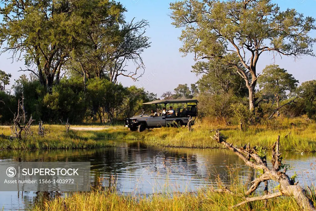 Typical landscape flooded Okavango Delta camp near Khwai River Lodge by Orient Express in Botswana, within the Moremi Game Reserve Wild . Undoubtedly,...