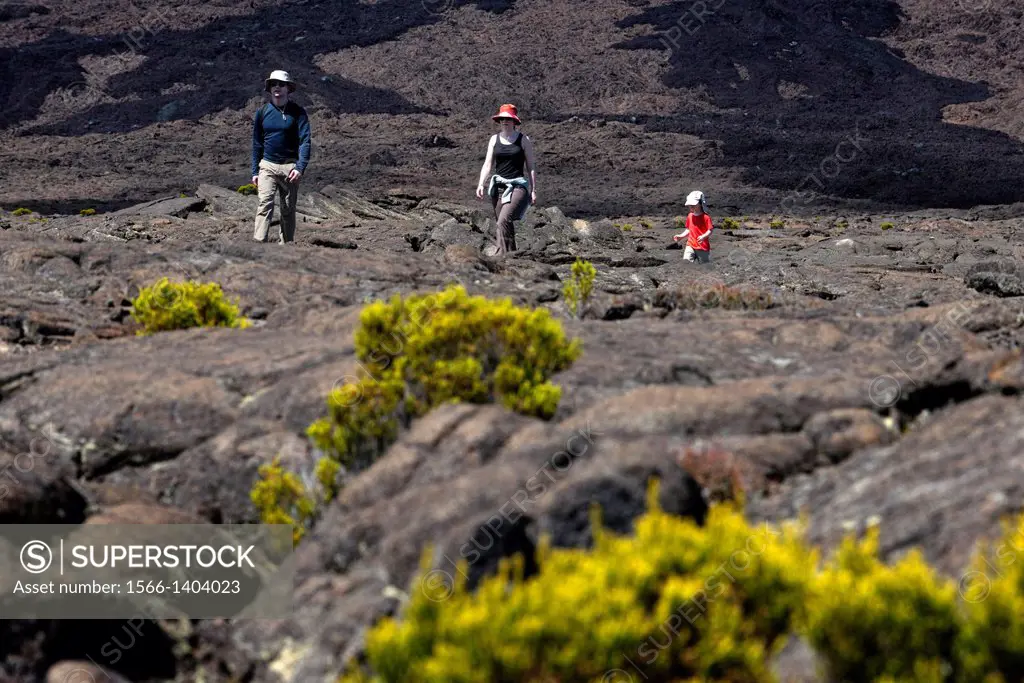 One family making a trek over the lava of volcano Piton de la Fournaise. It is the only active volcano on the island. Its eruptions attract thousands ...