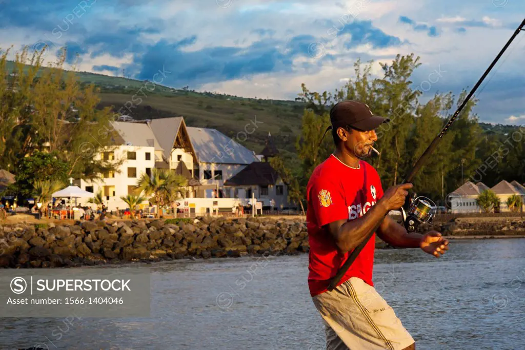 A fisherman in the port of Saint Leu. La Réunion left the Indian ocean bottom. The first foundations of the island was formed about 67 million years a...