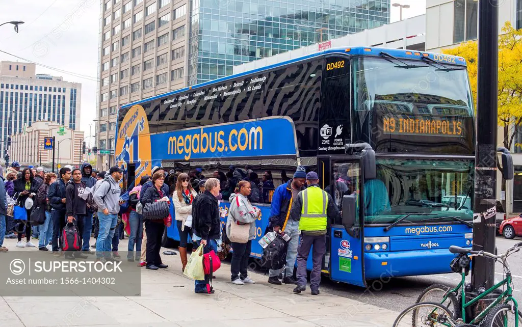 Chicago, Illinois - Passengers board a Megabus headed for Indianapolis. Megabus is a low-cost intercity bus line that operates from curbsides rather t...