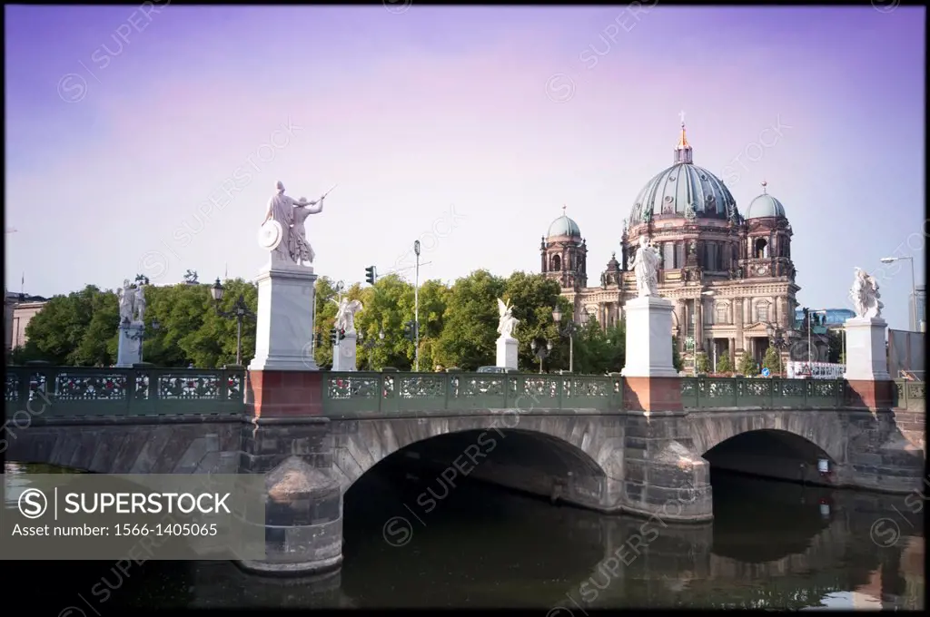 Germany, Berlin, Castle Bridge Crossing the River Spree background Berliner Dom Cathedral.