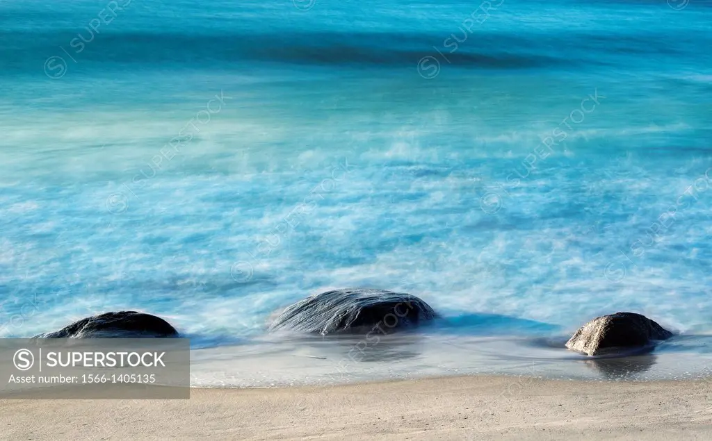 Rock with moving ocean water.