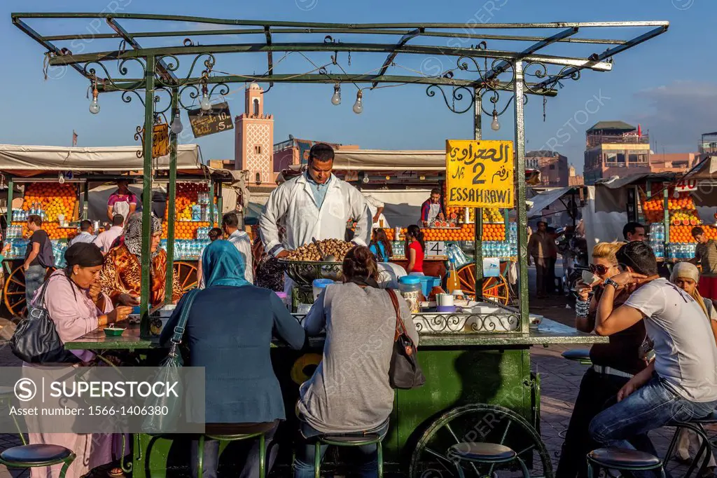 People Eating Snails at an Open Air Stall/Restaurant, Jemaa el-fna Square, Marrakech, Morocco.