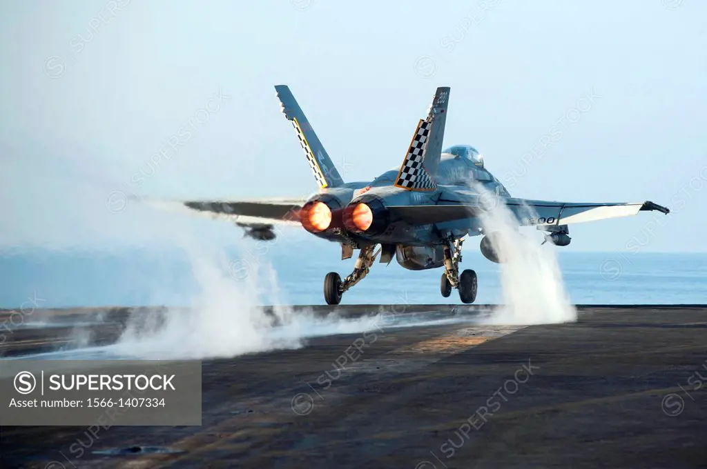 GULF OF OMAN (Dec. 12, 2013) An F/A-18C Hornet assigned to the Checkerboards of Marine Fighter Attack Squadron (VMFA) 312 launches from the aircraft c...
