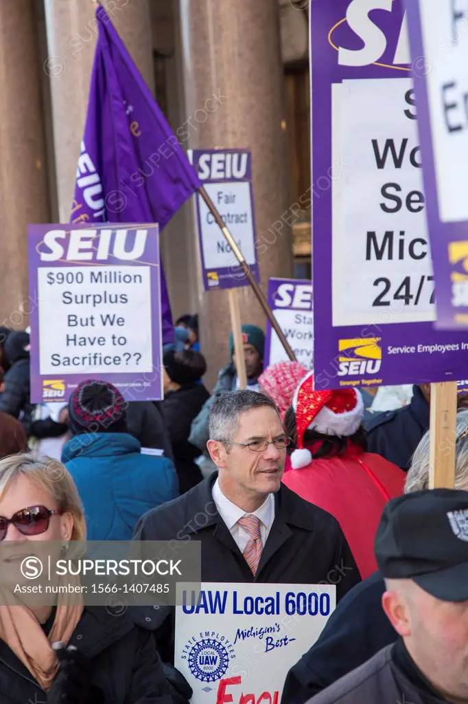Detroit, Michigan - Former Congressman Mark Schauer joins hundreds of state of Michigan employees who picketed the state office building to protest th...