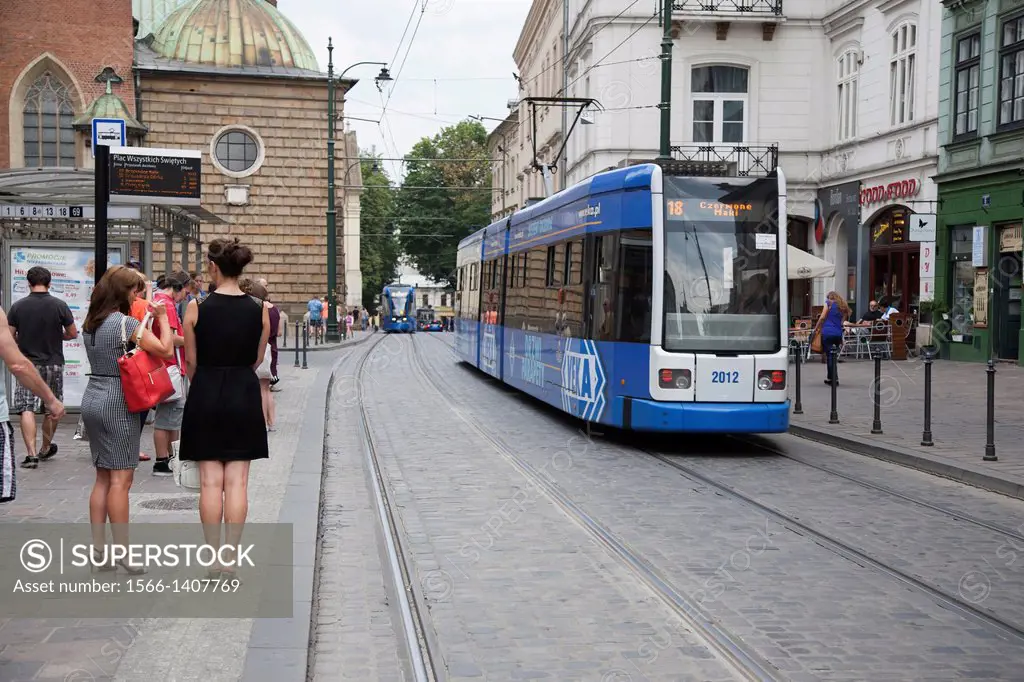 People and Tram in Dominikanski Square, Krakow, Poland,.