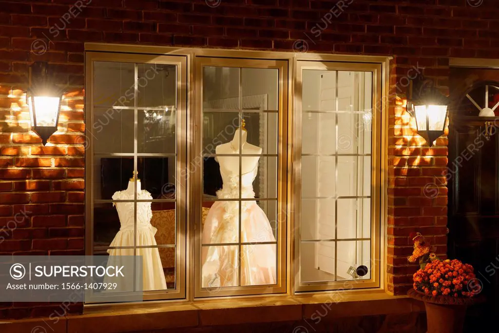 Dress shop window at night in historic Kleinberg Ontario.