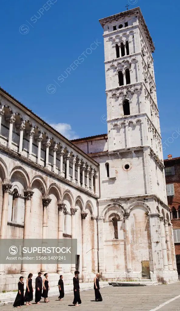 Art and Dance Group, San Michele in Foro is a Roman Catholic basilica church, St Michael square, Lucca, Tuscany, Italy, Europe.